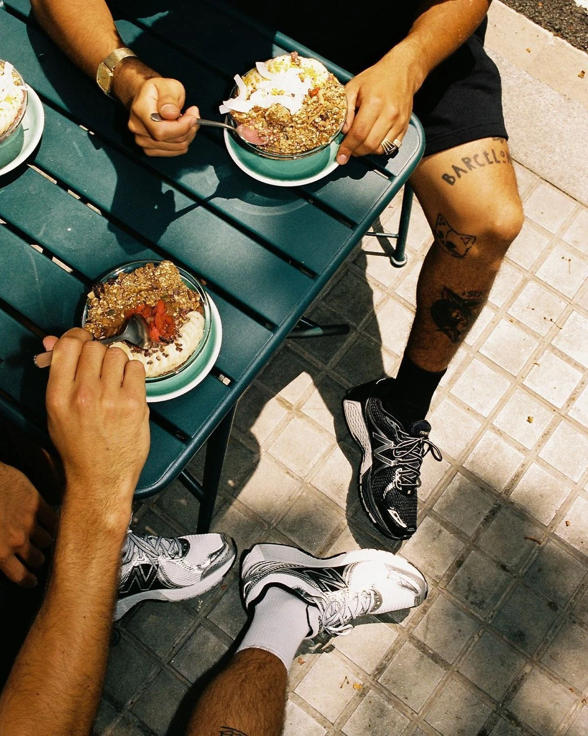 Friends sharing food outdoors in direct sunlight